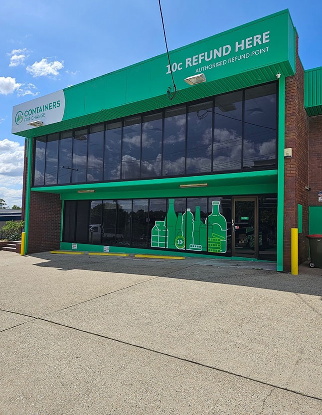 a person handing a plastic bottle to another person